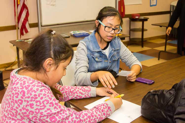 Students work in pairs as part of a VOCES program