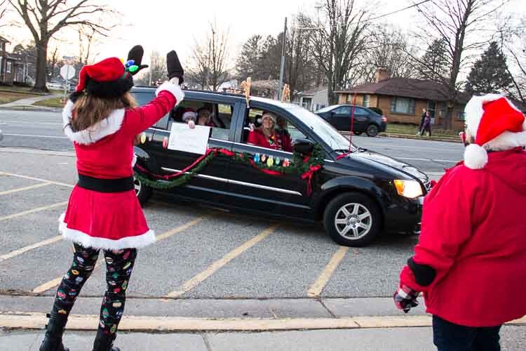 Staff greeted the students at the drive thru holiday parade.