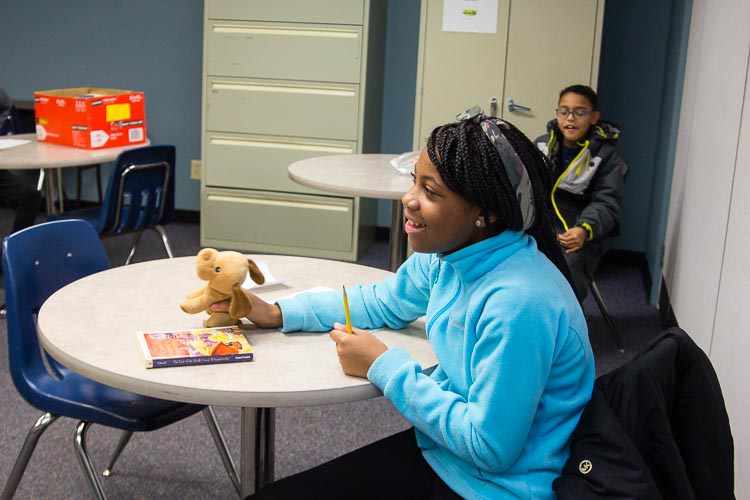 A stuffed puppy dog has a role in the fourth and fifth grade classroom of the after school program at New Genesis.