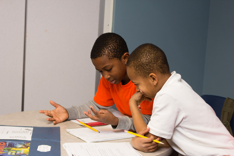 Youngsters work together in the New Genesis after-school program.