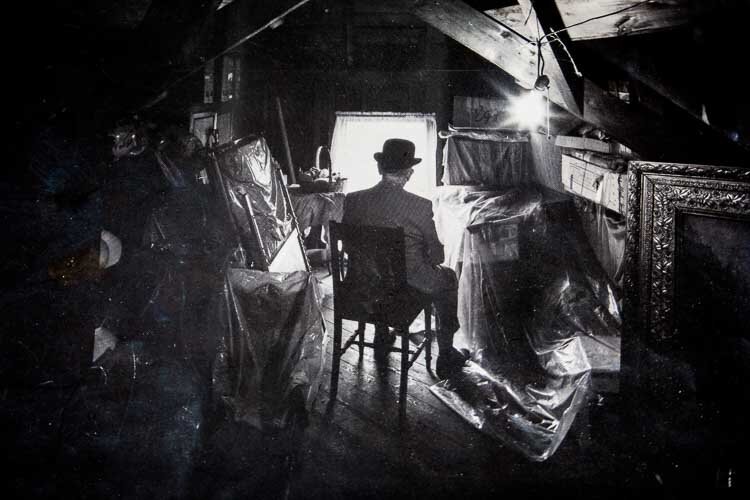 A photo of Harold Allen in the attic of the house. He was vice president of First National Bank and later served as a statistician and corporate secretary for The Upjohn Co.
