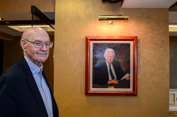 Floyd "Bud" Parks with a portrait of Irivng S. Gilmore Photo Mark Wedel