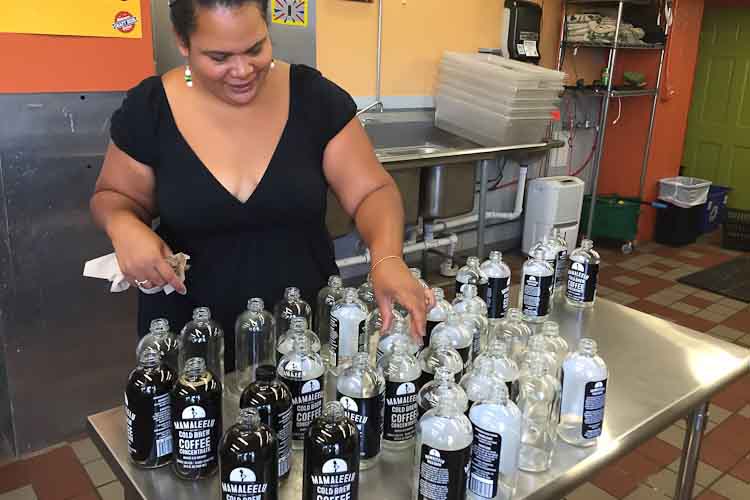 Maliesha Pullano works with her cold-brewed coffee