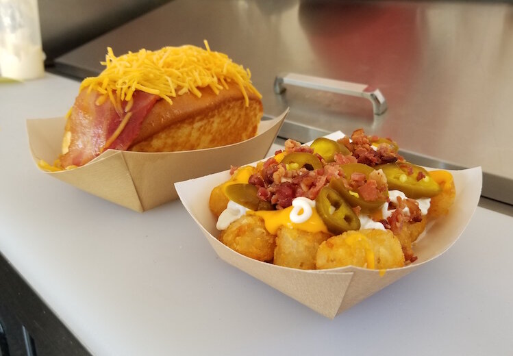 he bacon and cheese dog, left, is a current customer favorite. The tater tot dog is at right.