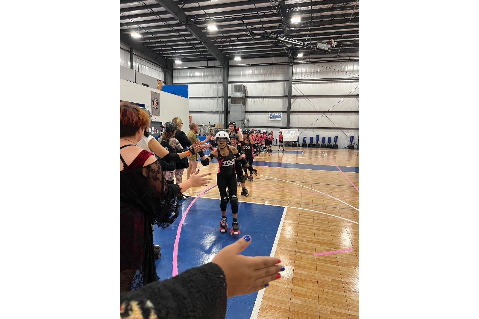 After the scrimmages, both teams lap the rink, and high five the audience. 