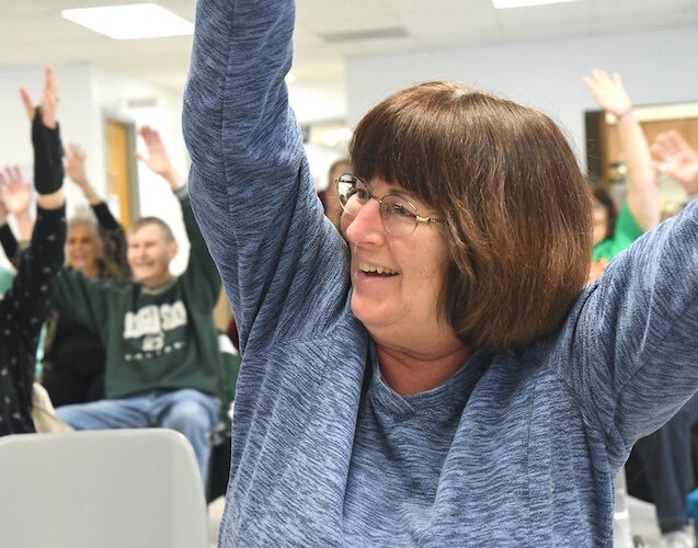 Julie Hume works out during a Senior Health Partners exercise class at the Trinity Neighborhood Center