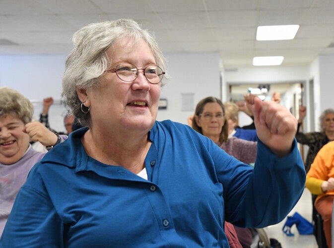Judy Decker works out during a Senior Health Partners exercise class at the Trinity Neighborhood Center.