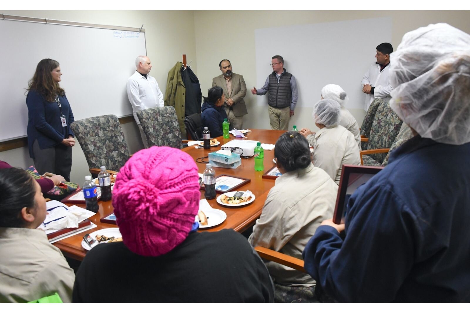 Scene at Snackwerks where ertificates were presented to employees who completed the “Workforce English as a New Language” course.