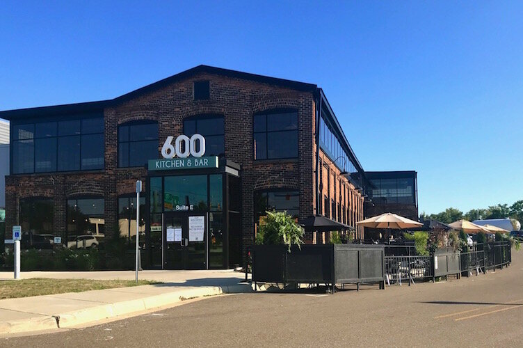 Last weekend, the outdoor seating at 600 Kitchen & Bar (at 600 E. Michigan Ave.), more than doubled with the expansion of seating into an area that had been parking spaces on the west side of the business. It is shown at the right side of this image.