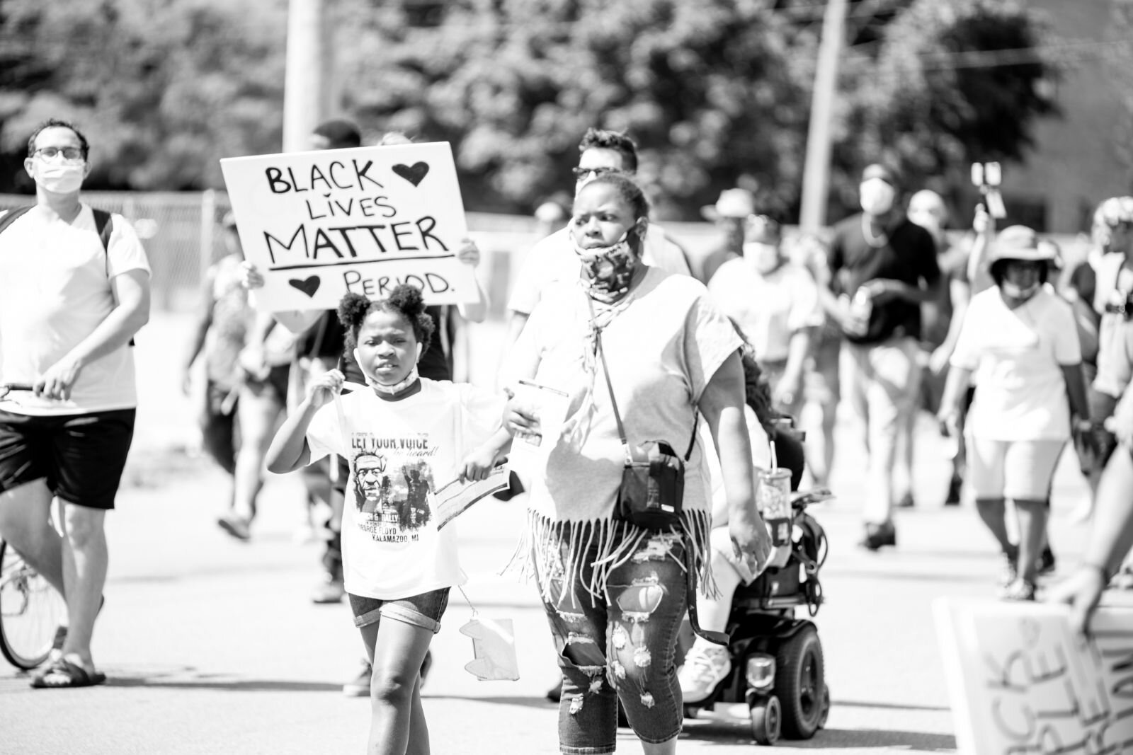 A few hundred people gathered Saturday afternoon in Bronson Park in downtown Kalamazoo for the “Let Your Voice Be Heard” rally and march.