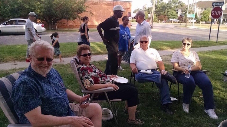 Residents are shown participating in the Stuart Neighborhood Association's 2015 National Night Out.