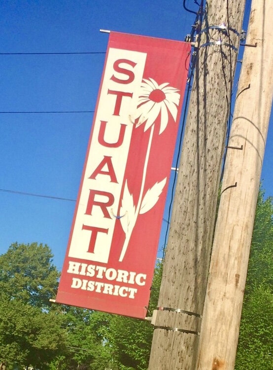 A banner lets people know they are in the Stuart Neighborhood.