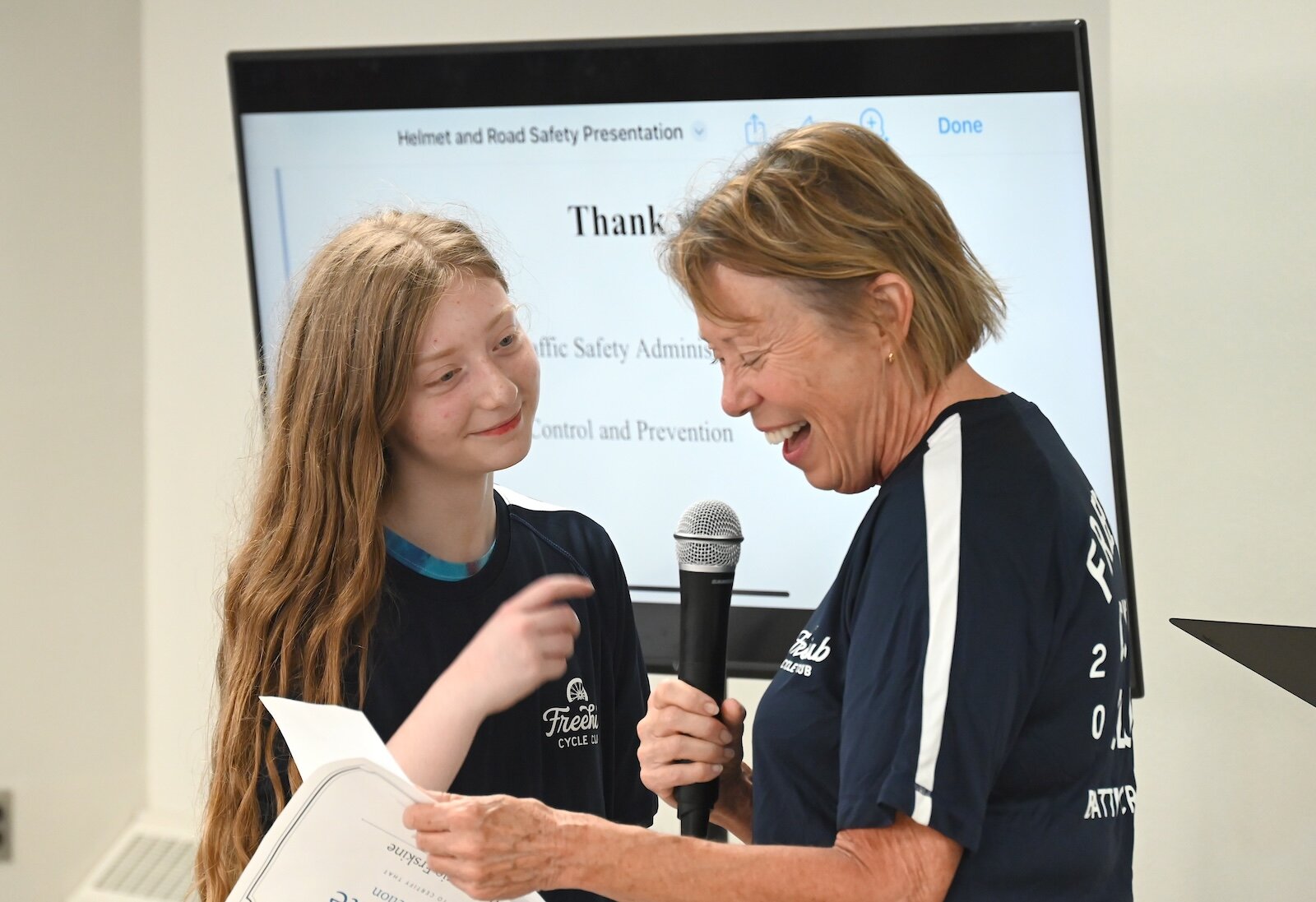 Mackenzie Erskine listens to her mentor Debbie Kelley talk about her during the Freehub Cycle Club’s meeting.