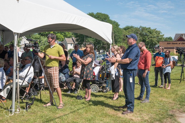 A behind-the-scenes relationships builder, Tammy Taylor is shown applauding the development of The Creamery from behind the cameras in June of 2019. The construction project was the largest in the Edison Neighborhood in many years.