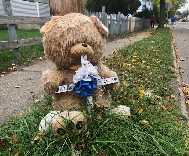 This teddy bear marks the location in the 900 block of Douglas Avenue where a young man was gunned down on Aug. 25, 2019. Such memorials have gotten to be more common in Kalamazoo’s core communities as the number of shooting has risen.