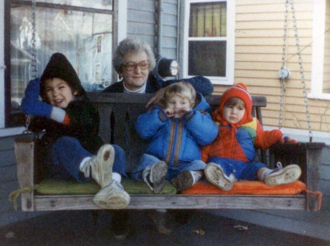 Grandma Charlotte Ferraro gathers with a few of her grandchildren on the famous Ferraro porch swing.