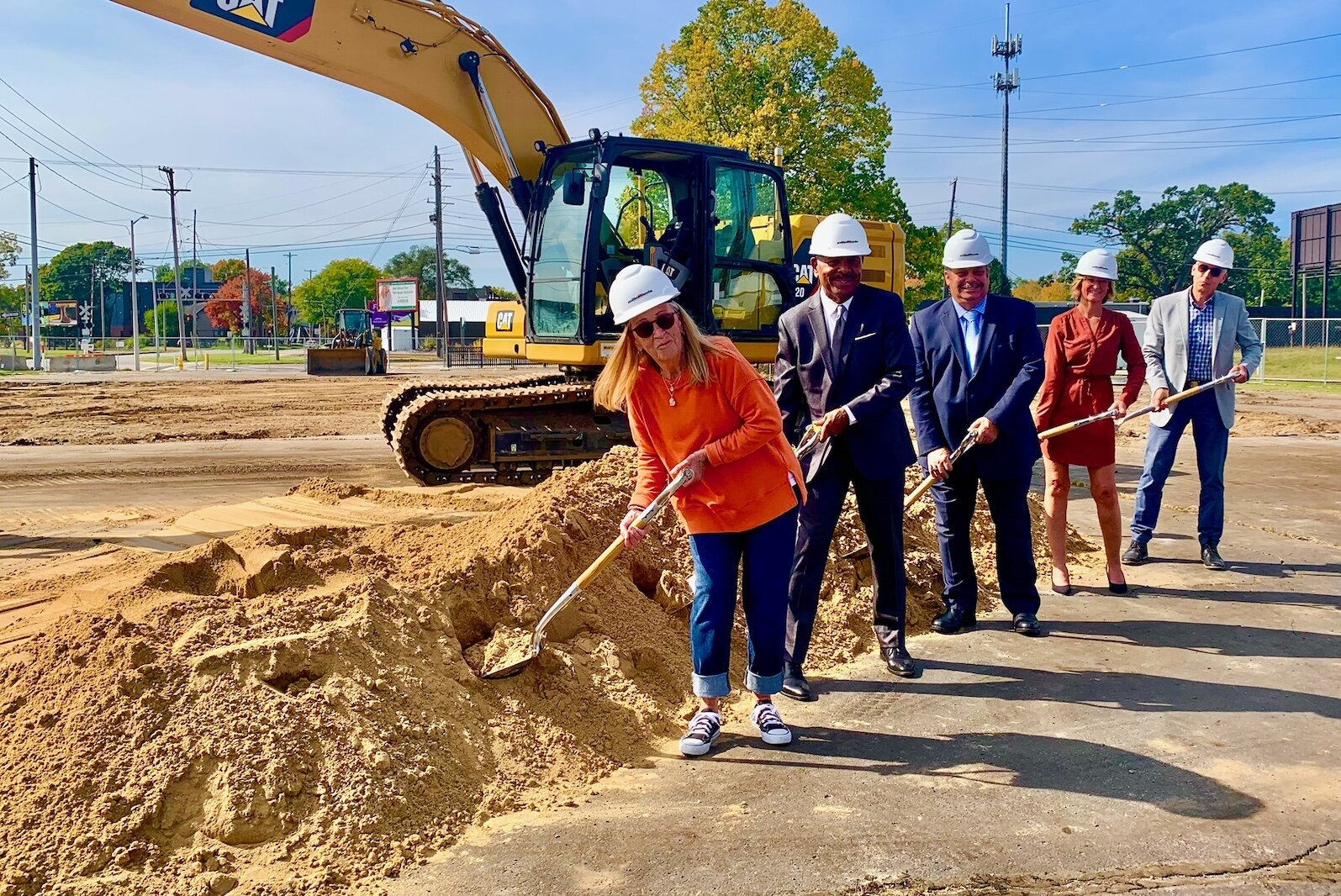 Administrators and members of the Integrated Services of Kalamazoo Board of Directors break ground Wednesday, Oct. 5, 2022, on the organization's Behavioral Health Urgent Care and Access Center. 