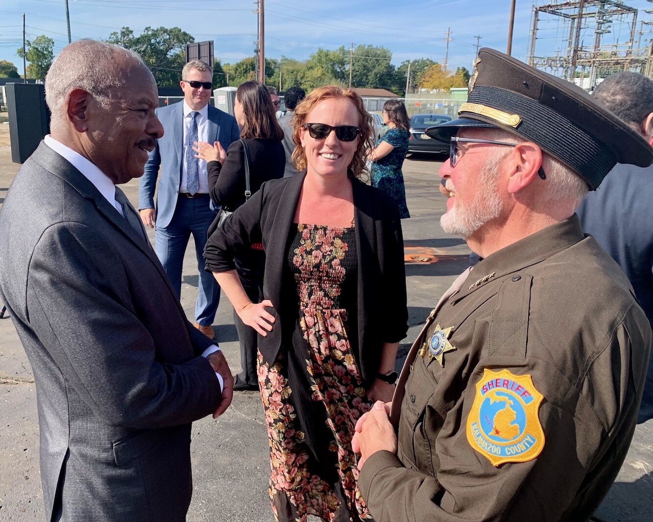 Jeff Patton, chief executive of ISK,left, speaks with services providers and others during the Wednesday, Oct. 5, 2022 groundbreaking ceremony for ISK's new  Behavioral Health Urgent Care and Access Center. At right is County Sheriff Rick Fuller.