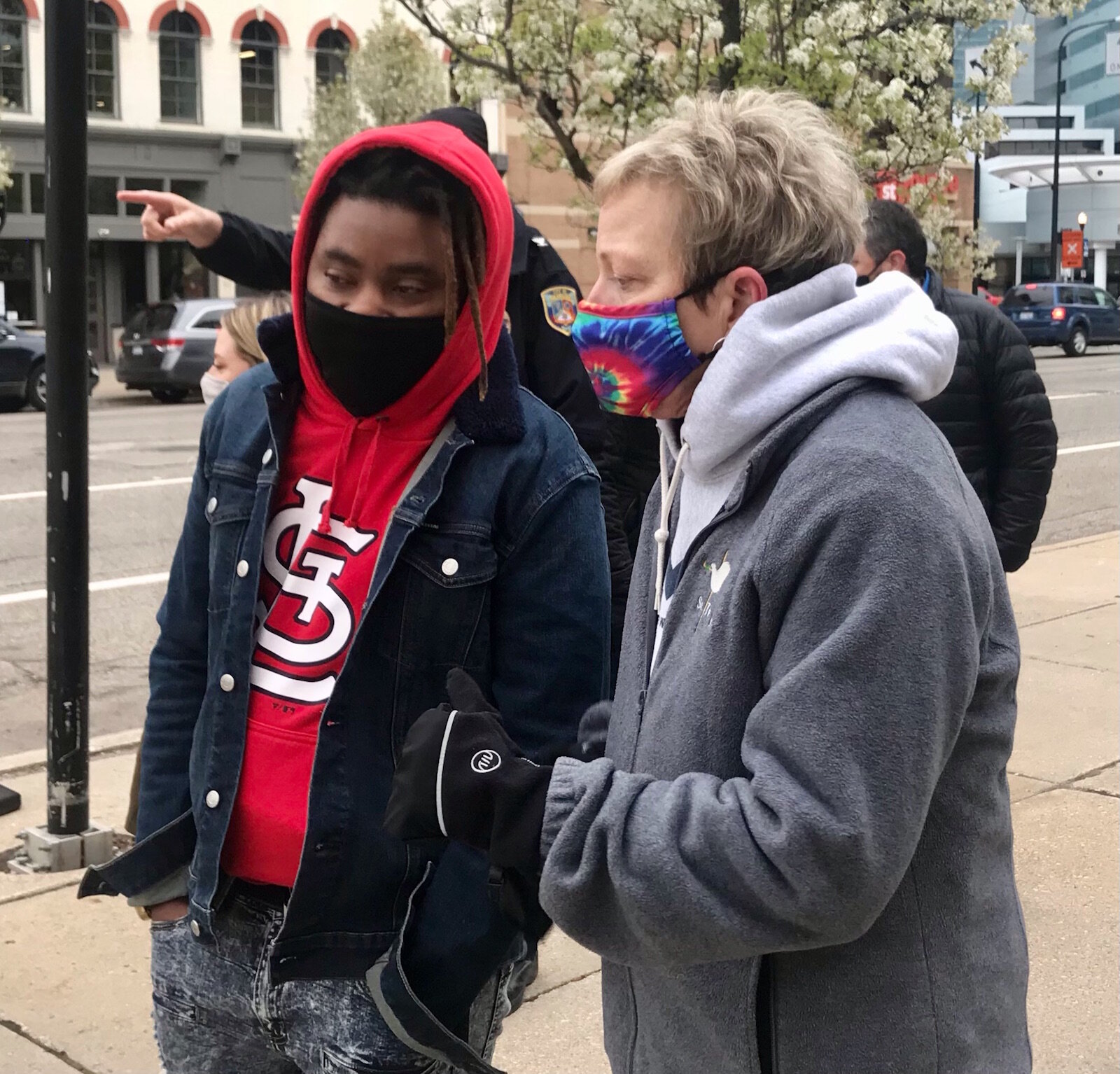 Local activists Quinton Bryant speaks Tuesday, April 20, 2021, with Kalamazoo City Commissioner Jeanne Hess.