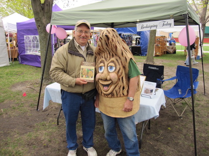 Vic Eichler holds a copy of his book on morels. Photo courtesy Vic Eichler