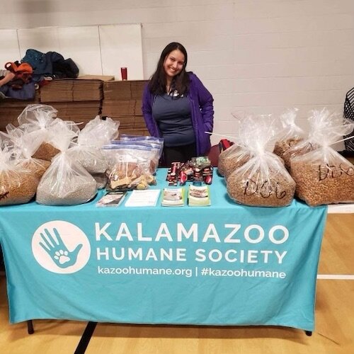 Alejandra Morales, outreach coordinator for the Kalamazoo Humane Society, prepares to provide supplies for pets at the Community Warming Center.