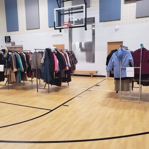 The Kalamazoo Community Warming Center utilizes the gymnasium of the Kalamazoo Salvation Army to provide a warm space, as well as coats, clothing, blankets, , hygiene products, a hot meal, and other items that have been donated.
