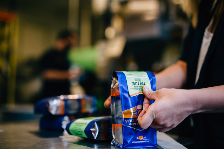 Finishing touches on a bag at Water Street Roaster