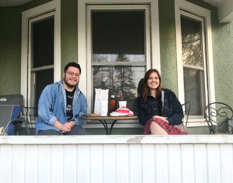 “It’s nice,” Cole Boulette says of the West Douglas Neighborhood and the house he and roommates lease at Forbes and Hilbert streets. He sits with former Three Rivers classmate Sarma Arums, now of Chicago.