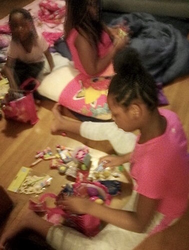 Dominique Wilder is shown playing games with her two daughters on the first floor of the Wilder home. They inhabited the downstairs of the Wilder’s Kalamazoo home while Michael Wilder was quarantined on the second floor.