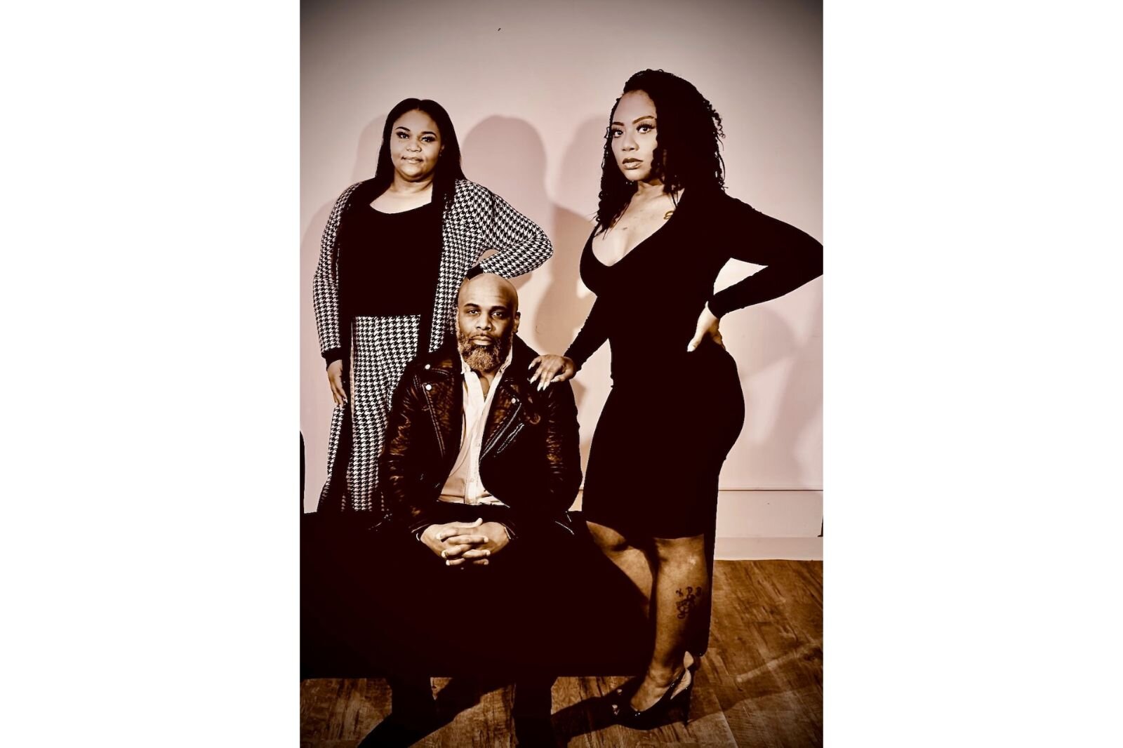  The Xperience by Luxury Escape asks people to put some effort into what they wear when they come to events. Bryan Sims sits between business partners Symphony Ollie, left, and Kim Guess.