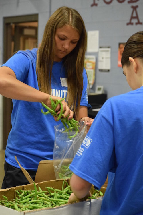 The United Way at work before the coronavirus hit. This is from 2019 Youth Day of Caring, where a group of Battle Creek high school students volunteered at the South Michigan Food Bank.