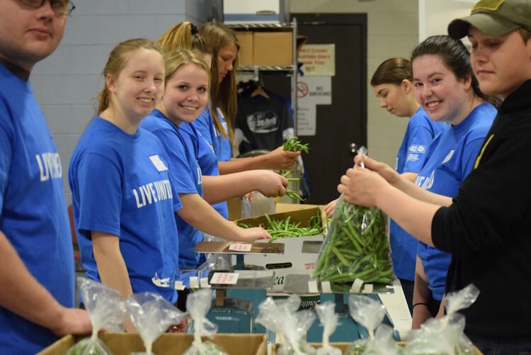 Volunteers help in a local food pantry.