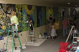 Local artists worked to transform Port Huron's Military Street tunnel, creating original designs and learning how to translate that into a large-scale mural.