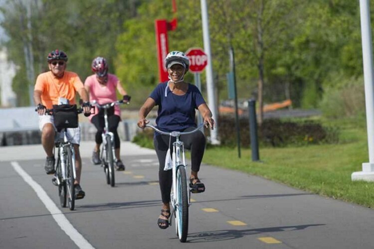 Byclists enjoy a greenway in Detroit.