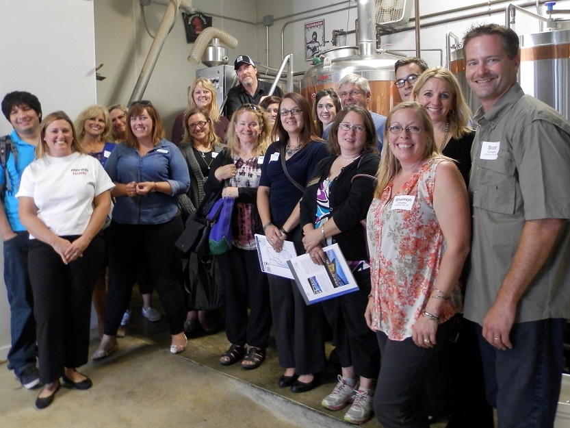 Entrepreneurs Dennis Doyle of ThumbCoast, Pamela Dusci of American Patriot Hops  and Scott and Shannon Schwabe of Hoppily Ever After were presenters. Dusci is on far left in front; the Schwabes on the right front, and Doyle at the top of the stairs i