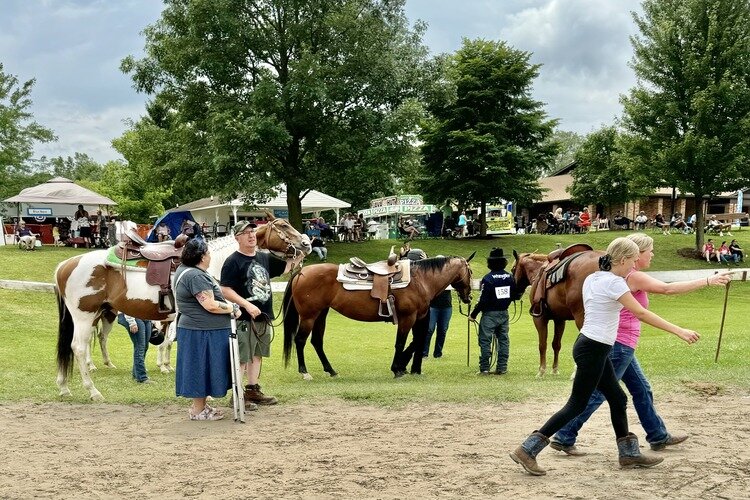 4-H participants and family wait for the horse judging.