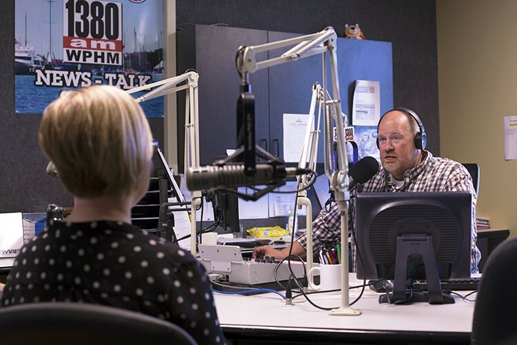 Host of the “WPHM Morning Show” at 1380 WPHM-AM, Paul Miller, interviews the Director of the St. Clair County Library System, Allison Arnold, in the studio on Tuesday, June 22, 2021.