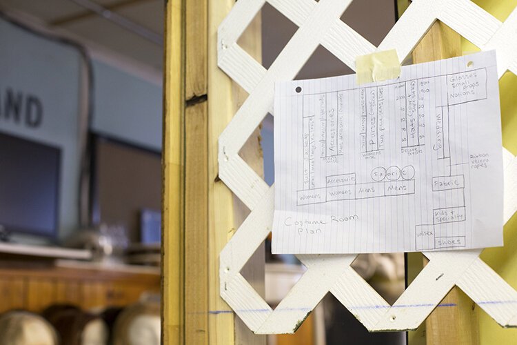 The design plan for a renovated costume room hangs outside the doorway of the space at the Richmond Community Theatre.