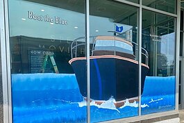 A Boat the Blue-themed storefront mural from local artist Faith Serio.