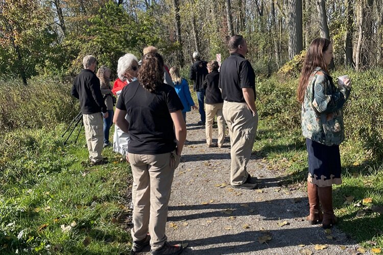 Participants in Macomb's October birding trail launch event look for birds at Lake St. Clair Metropark.