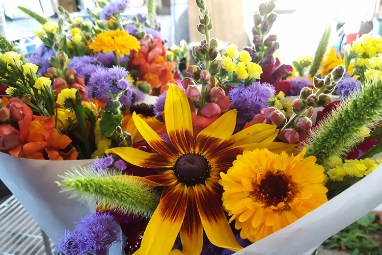 Mixed bouquets wrapped up and ready for delivery to Neiman's.Market