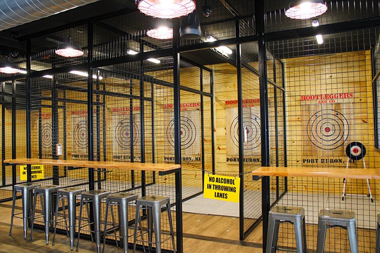 Bootleggers Axe Co. in downtown Port Huron has eight caged axe-throwing lanes.