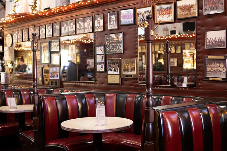 The Brass Rail Bar offers plenty of seating with the iconic red-and-black booths throughout the establishment.