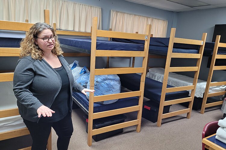 Interim Executive Director Renee Pettinger shows the sleeping arrangements at Blue Water Area Rescue Mission.