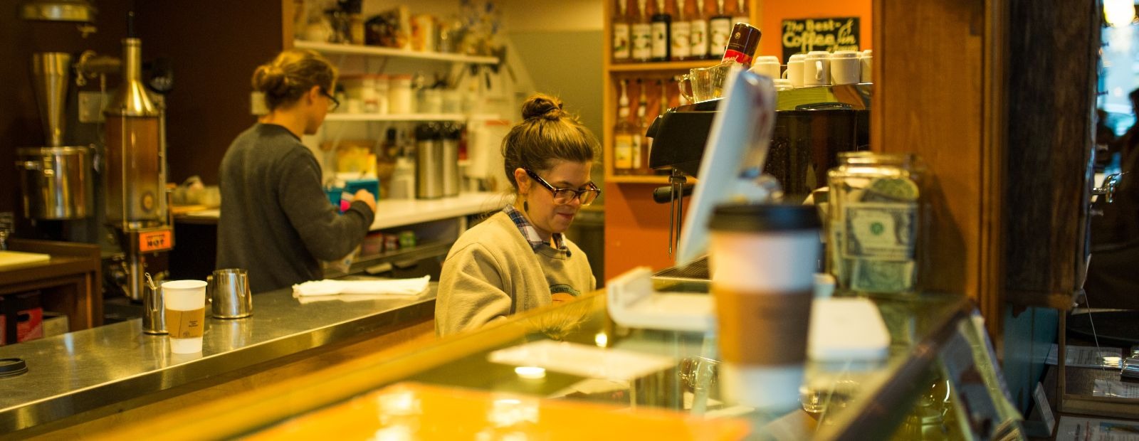 Maggie Bottenfield works on an order at Exquisite Corpse Coffee.