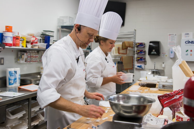 Culinary Insitute instructors Scott Twichell and Karlee Schulz demonstrate how to create a dish.