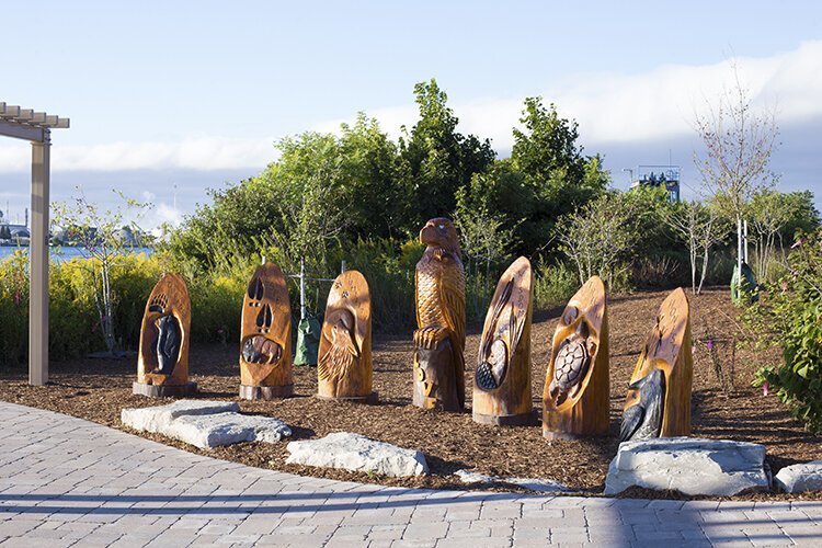 Garrett Nahdee's oak wood-carved sculptures of the Seven Grandfather Teachings depicts seven animals representing a different teaching, or value, to uphold.