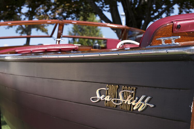 A 22-foot, 1958 Chris Craft Sea Skiff is displayed along the boardwalk at the River Street Marina during the Boat the Blue Antique & Classic Boat Show.