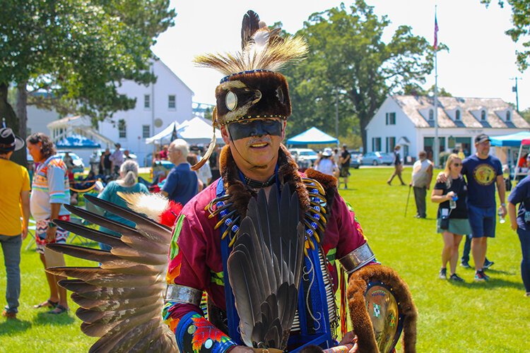 Men's Traditional Dancer in full regalia, the feathers have sacred meaning and should not be touched unless instructed.