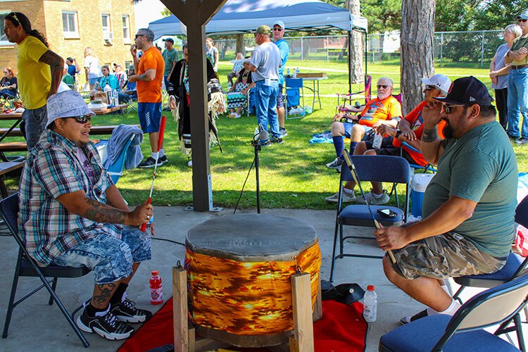 Host drummer, Moon Lake and co-host, play for the Men's Traditional Dance during this year's Blue Water Traditional Pow-Wow.